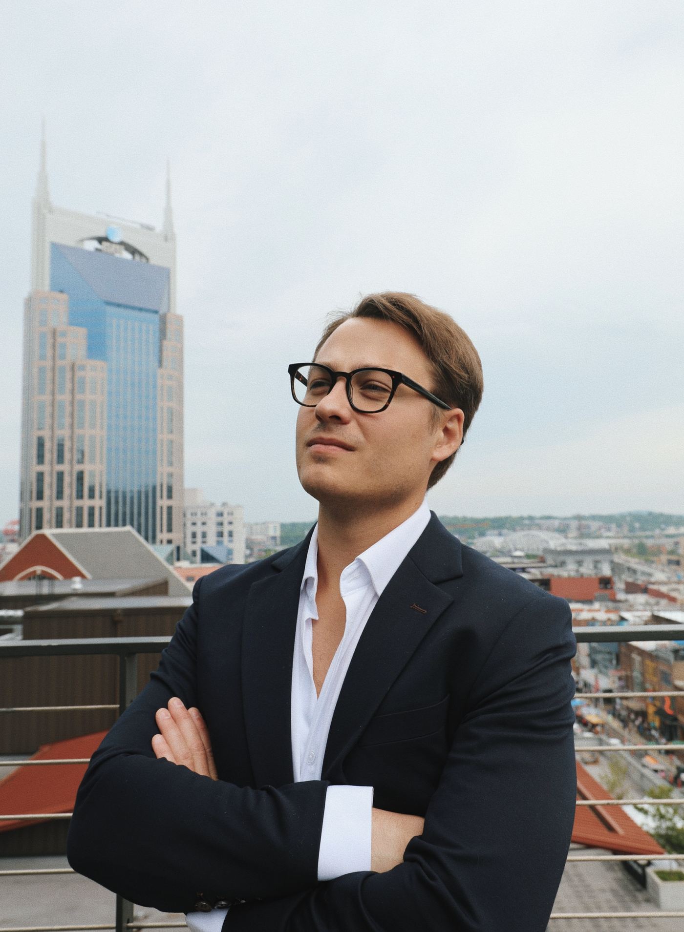 Kolton Stooksbury, founder of Raystone Automations, on a rooftop overlooking downtown Nashville